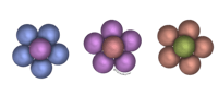 three different colored flowers on a black background